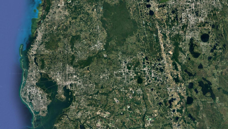 A very very zoomed out view of presumably Florida, taken from the sky. We're in the sky now.